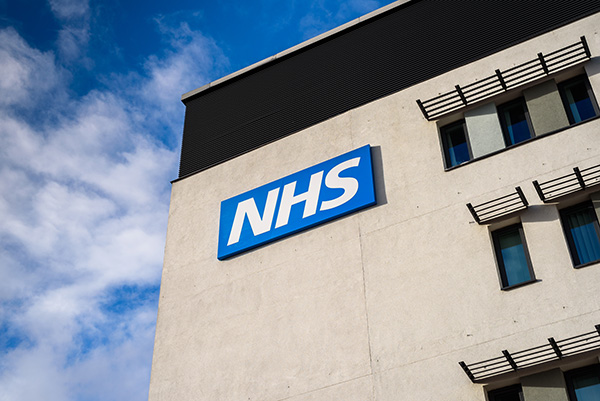 A building with an NHS sign on the side